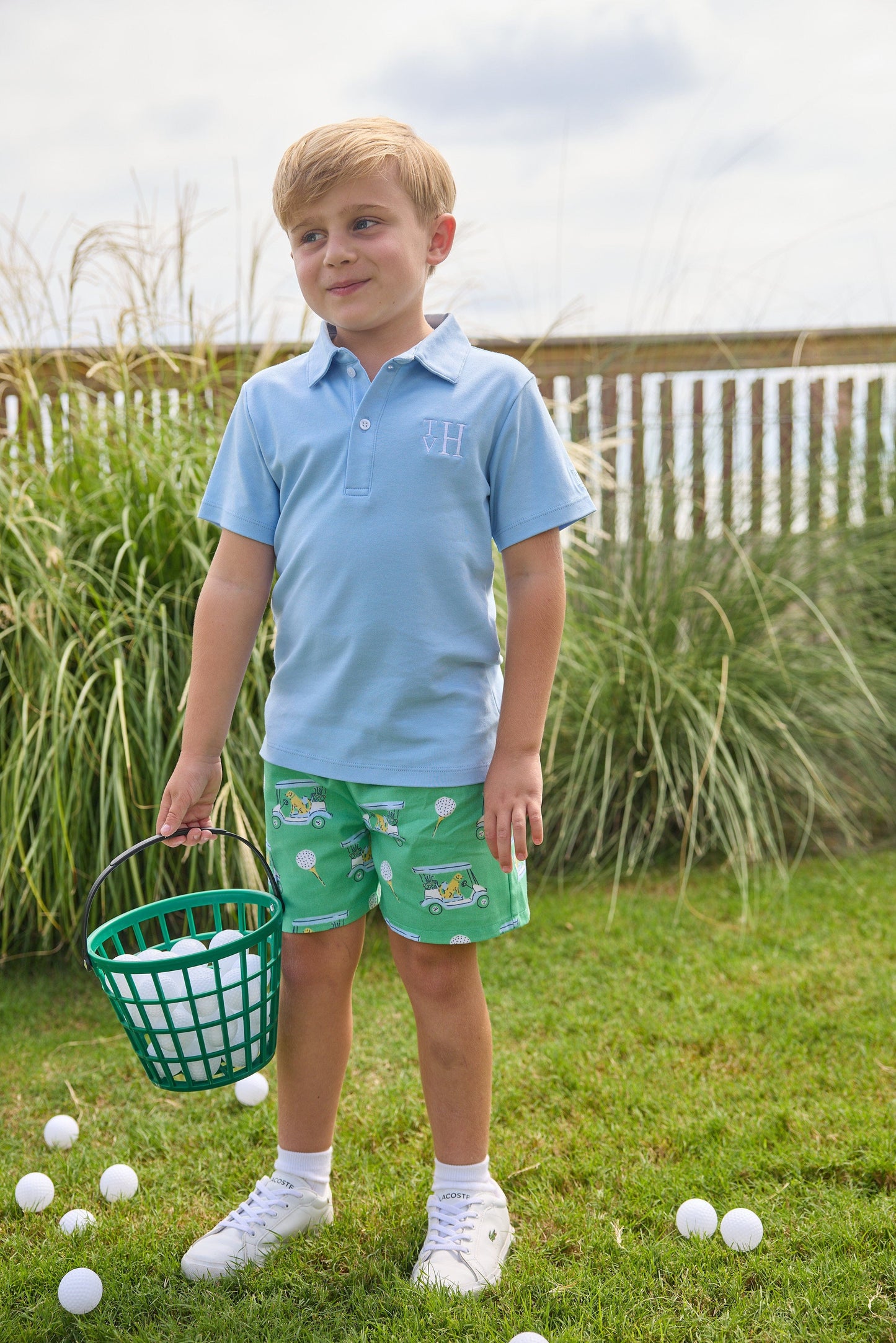 Little English traditional children's clothing. Boy's green twill shorts with golf cart print