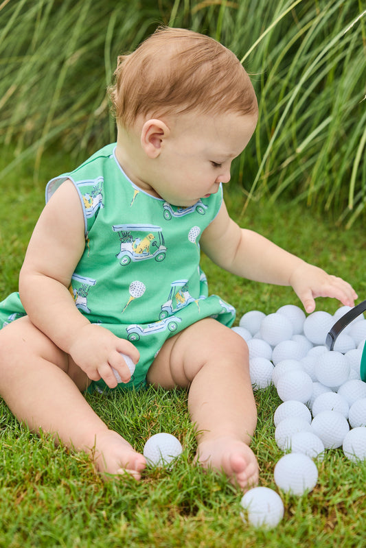 Little English traditional children's clothing. Green golf cart print bubble for baby boys.