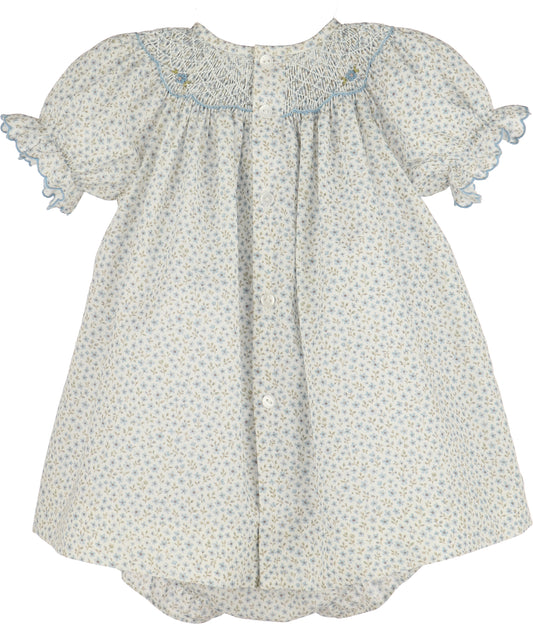 Floral dress with smocked neckline on a white background