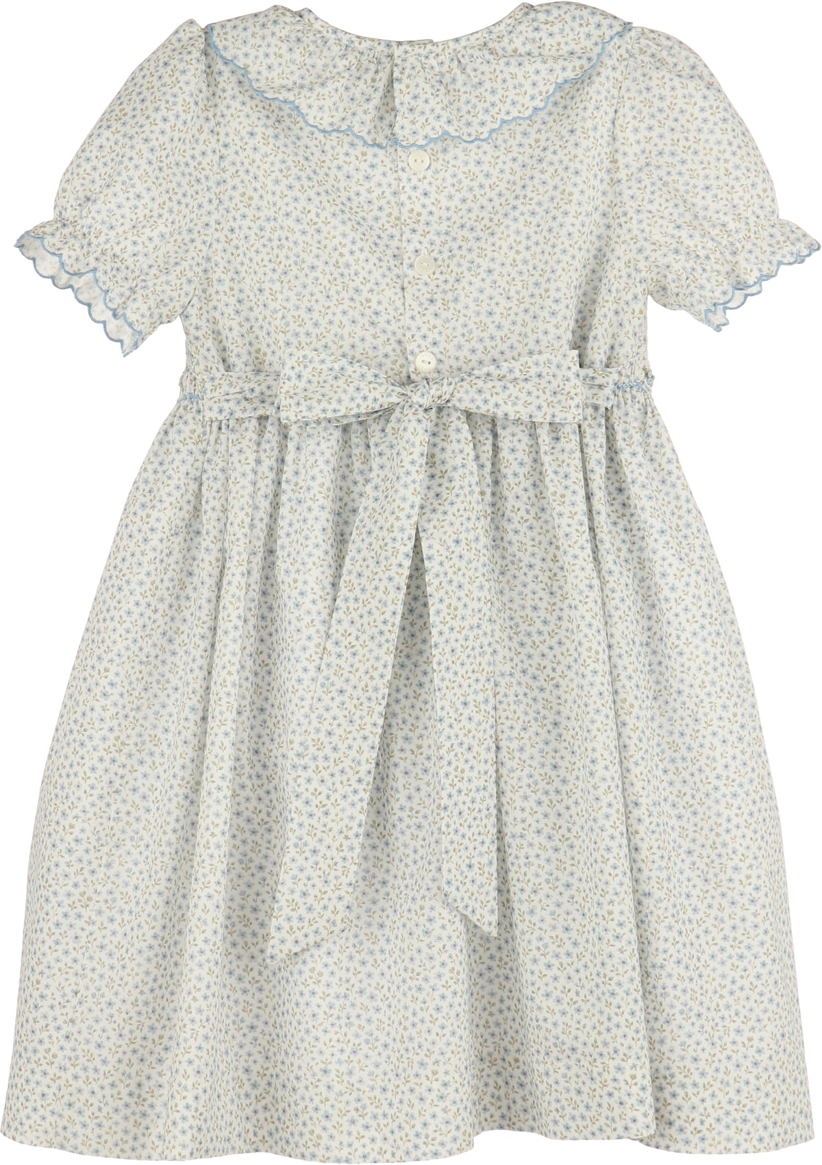 White dress with blue floral pattern on a white background
