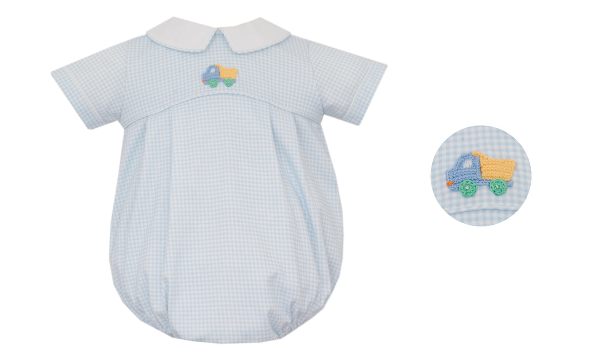 Baby romper with blue checkered pattern and embroidered toy on a white background