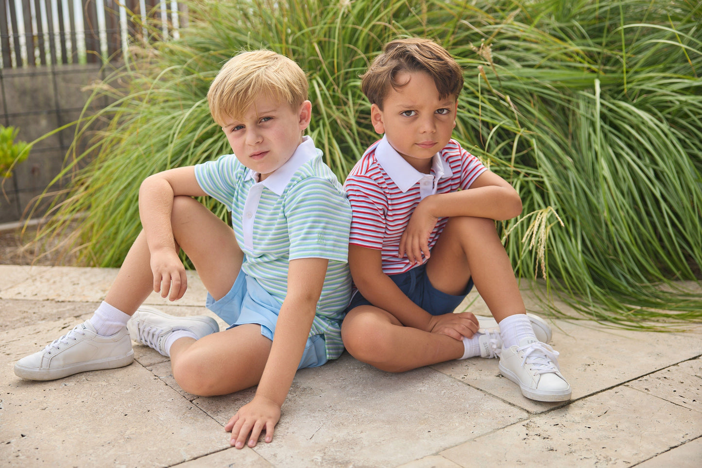 Little English classic short sleeve polo in blue, green, and white greenview stripe and red, white, and blue americana stripe. Sport short in light blue and navy. For little boy
