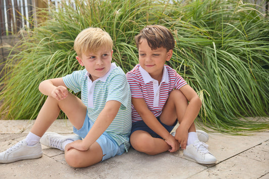 Little English classic short sleeve polo in blue, green, and white greenview stripe and red, white, and blue americana stripe. Sport short in light blue and navy. For little boy