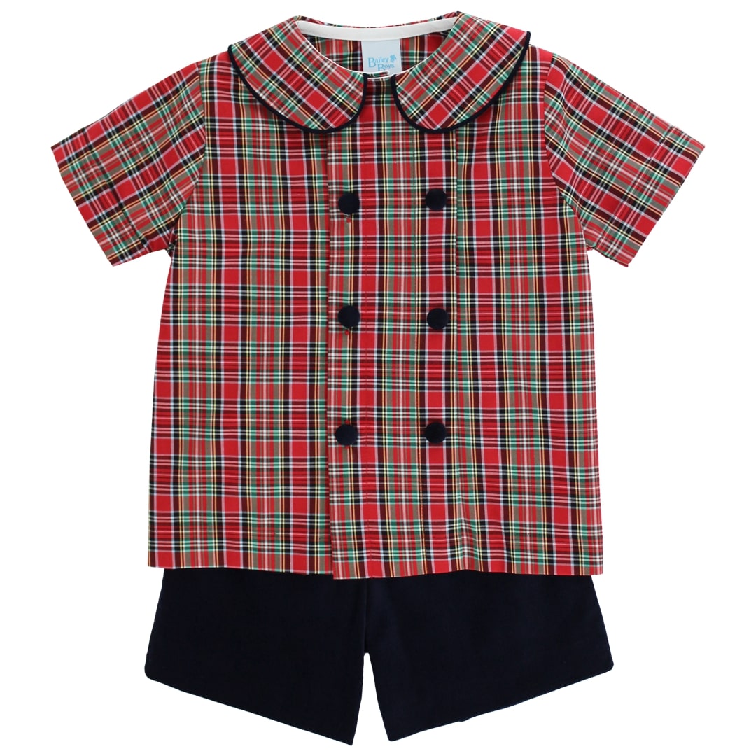 Red plaid shirt with black buttons and black shorts on a white background
