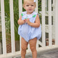 Little English traditional children's clothing.  Light blue seersucker gingham bubble with white bib collar and applique sailboats for baby girls.