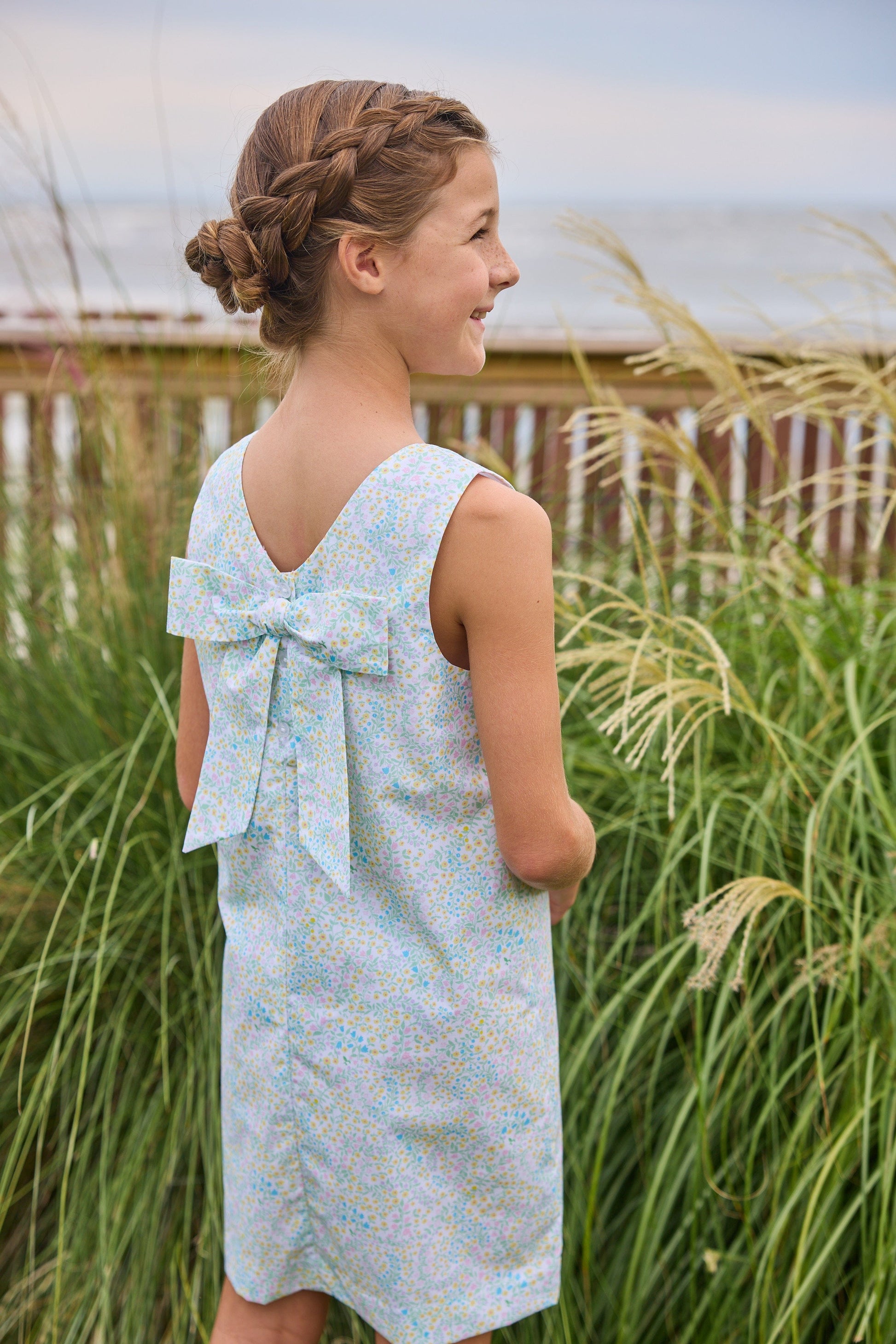 Little English traditional children's clothing.  Aqua, green, and yellow floral sleeveless dress for girls
