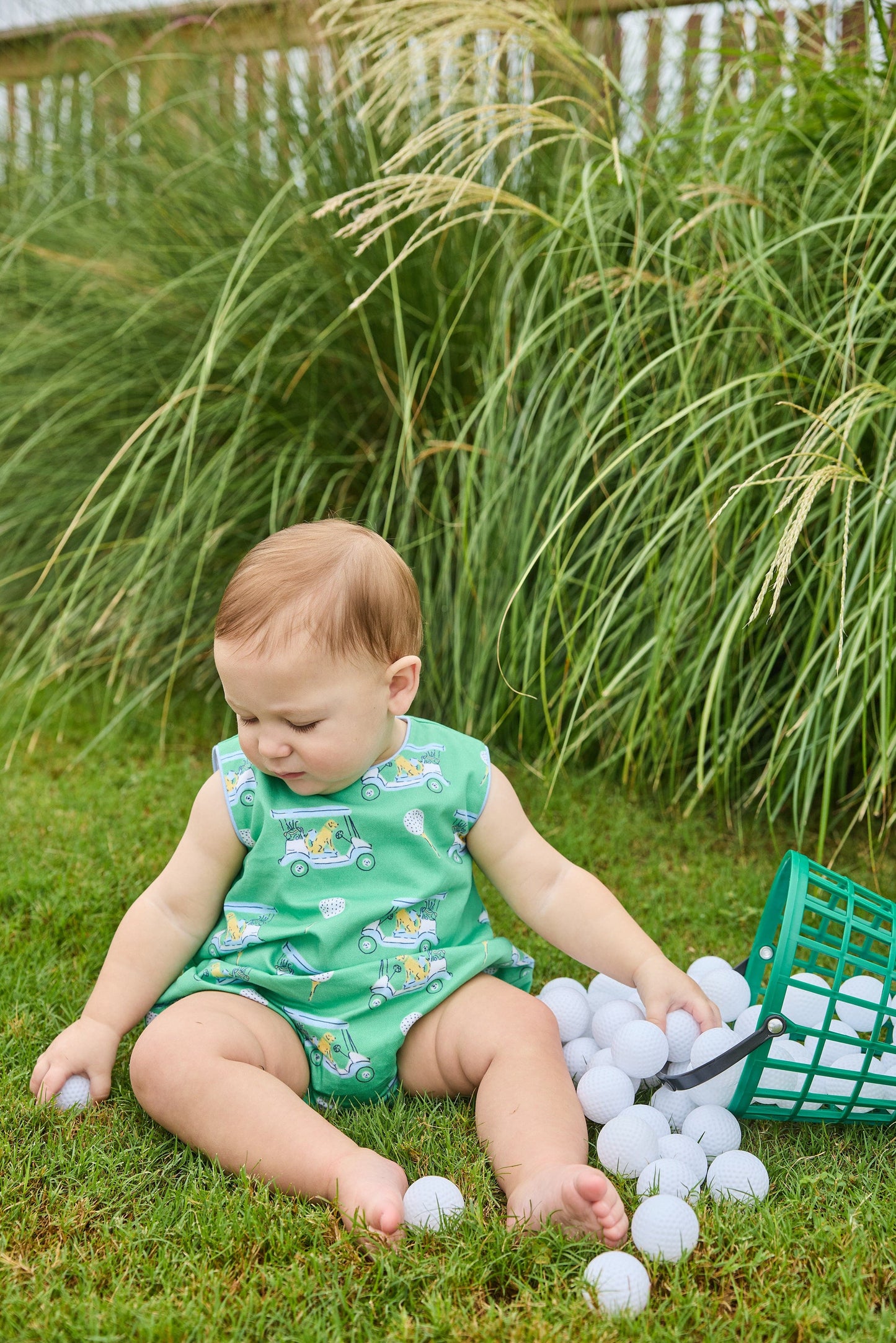Little English traditional children's clothing.  Green golf cart print bubble for baby boys.