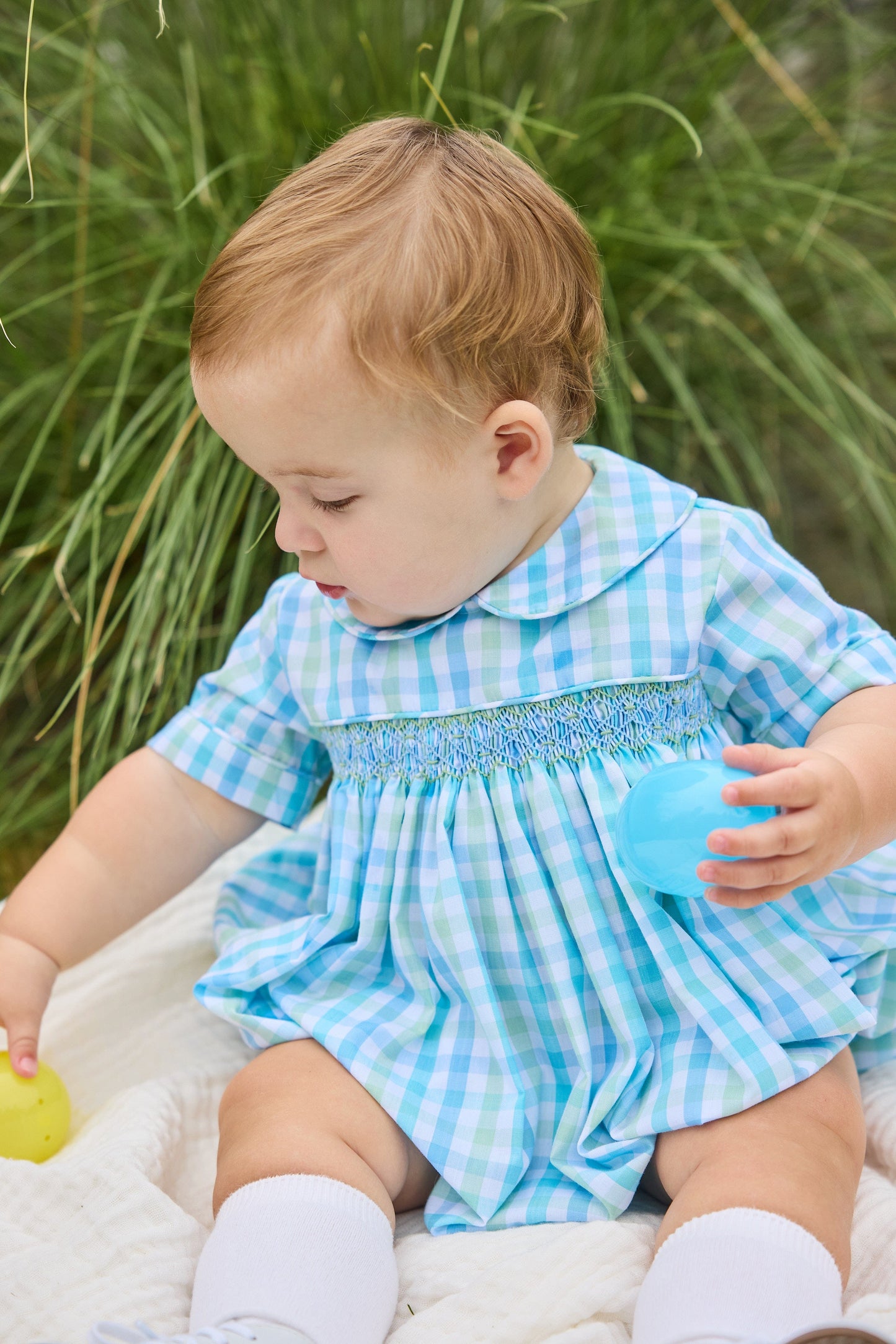 Little English traditional children's clothing.  Baby boy's aqua and green plaid bubble with peter pan collar and smocking across the chest.