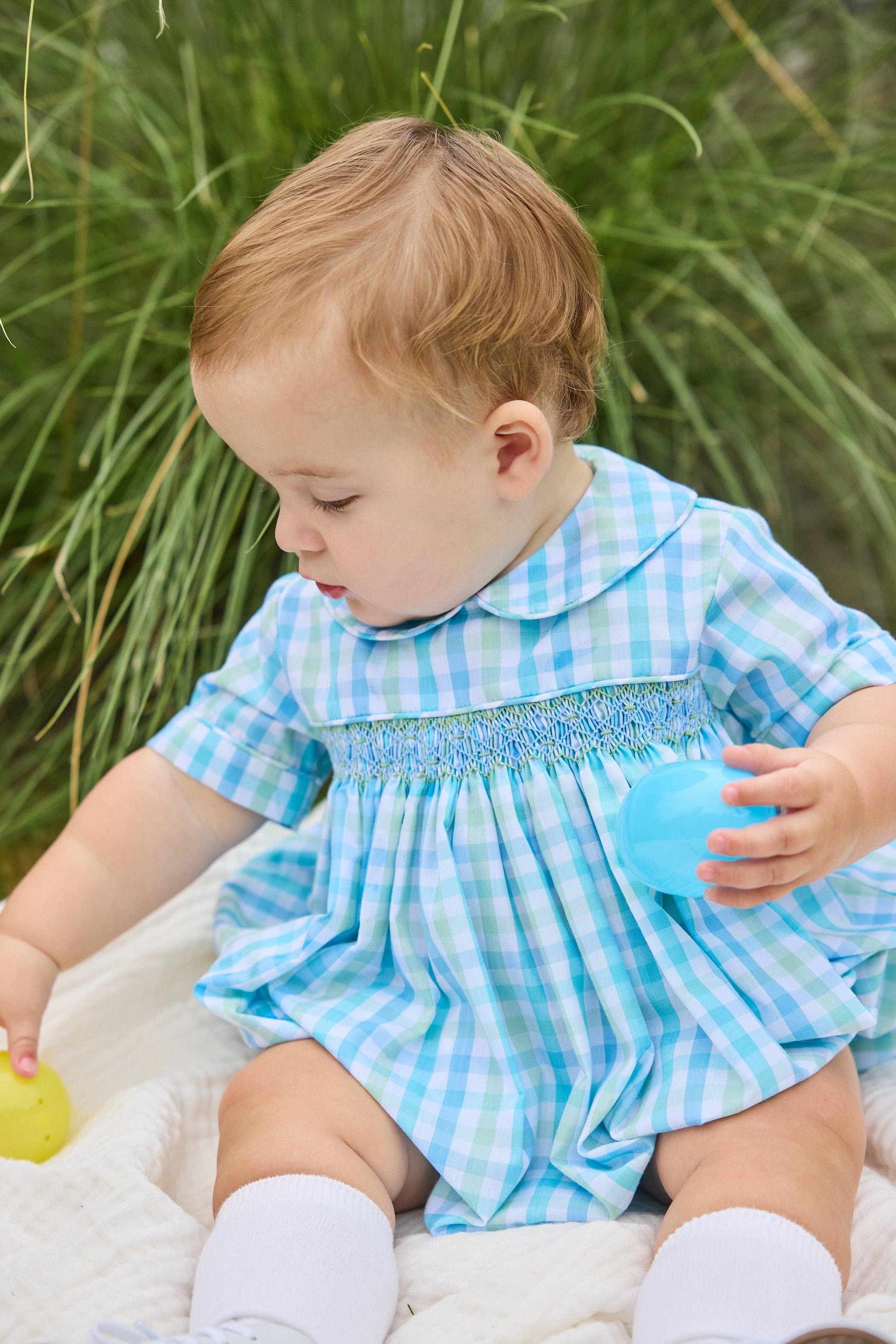 Little English traditional children's clothing.  Baby boy's aqua and green plaid bubble with peter pan collar and smocking across the chest.