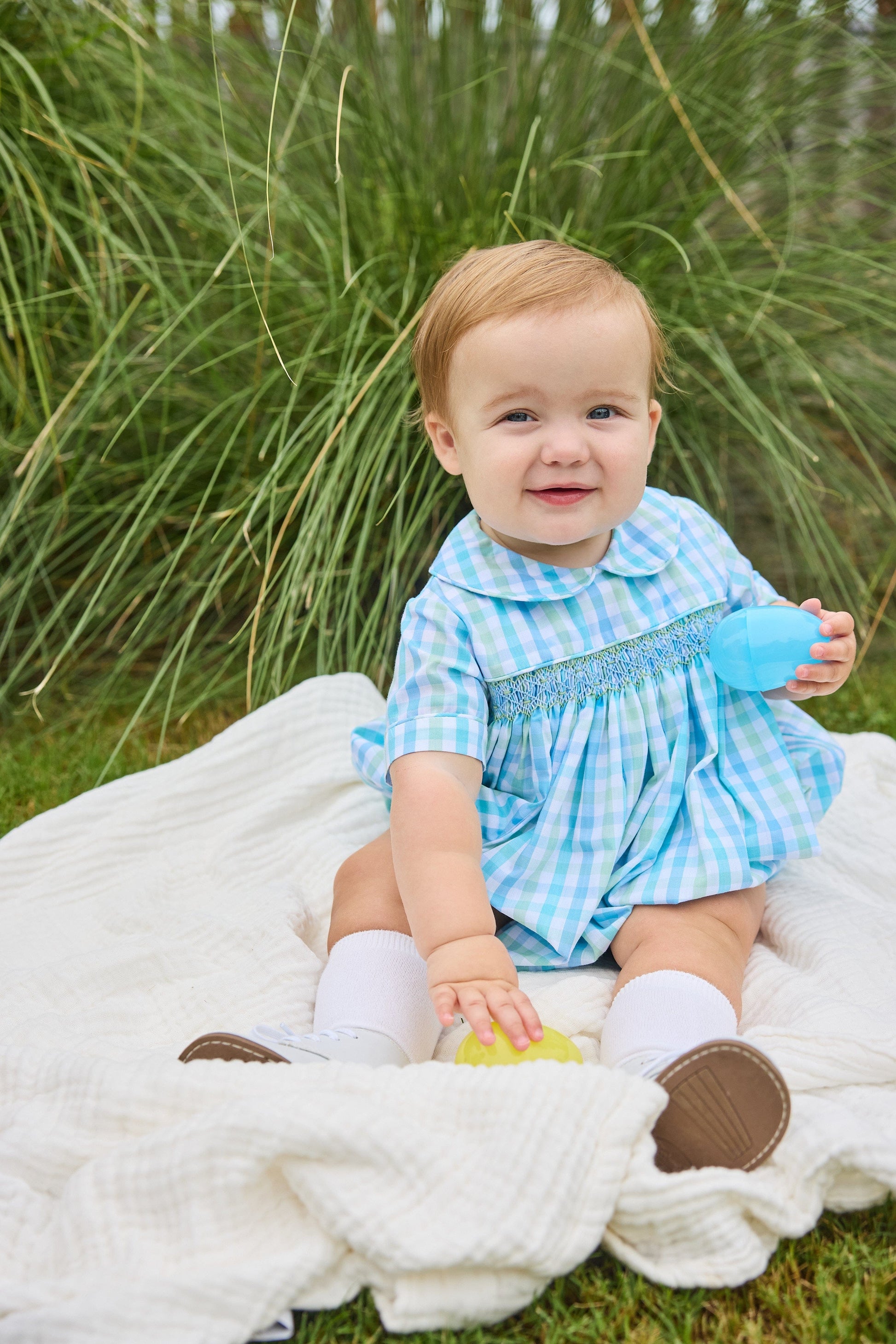 Little English traditional children's clothing.  Baby boy's aqua and green plaid bubble with peter pan collar and smocking across the chest.