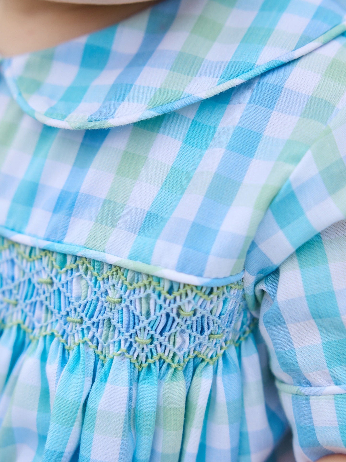 Little English traditional children's clothing.  Baby boy's aqua and green plaid bubble with peter pan collar and smocking across the chest.