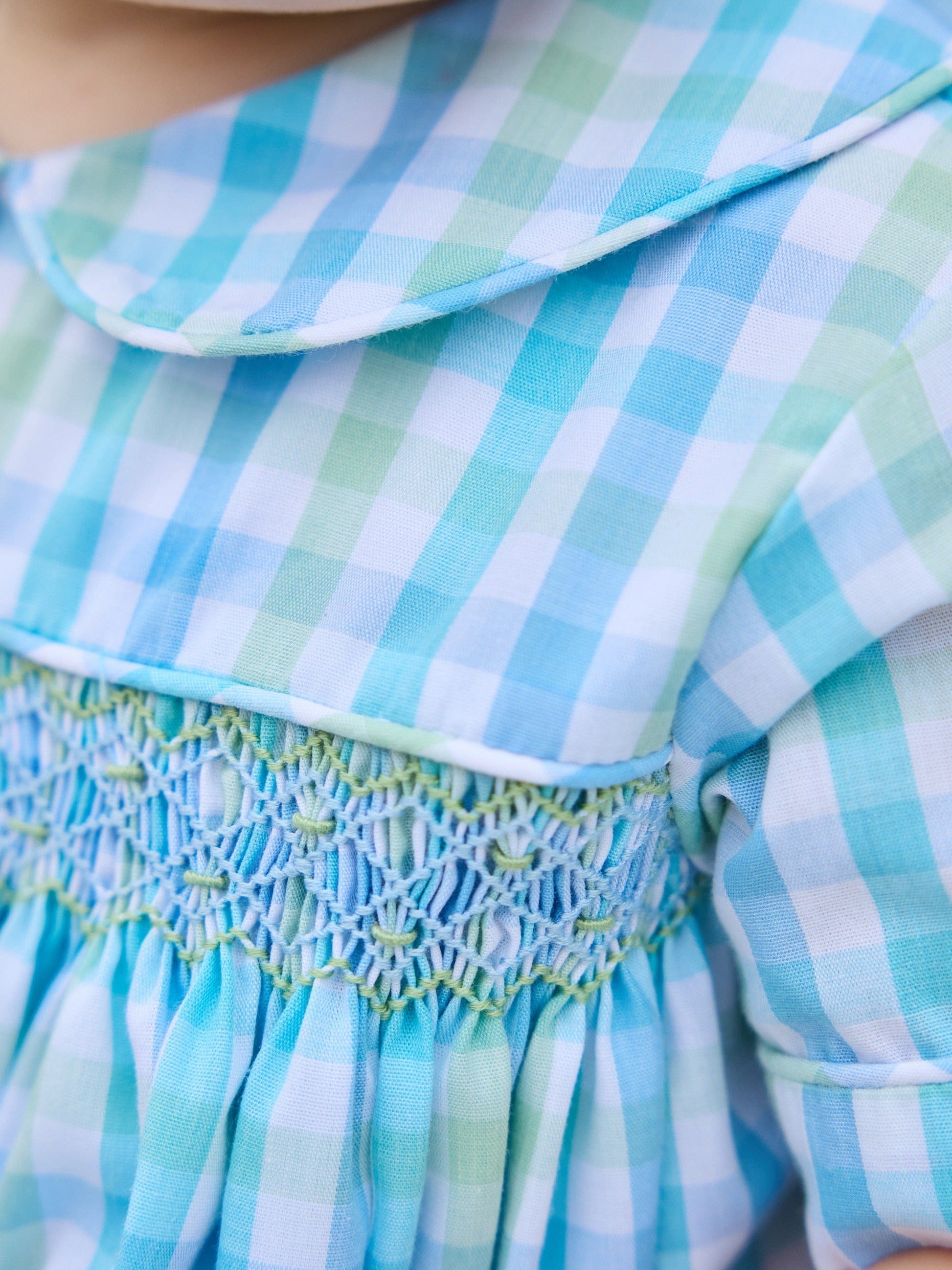 Little English traditional children's clothing.  Baby boy's aqua and green plaid bubble with peter pan collar and smocking across the chest.