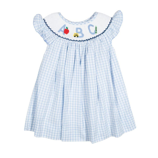 Children's dress with ABC embroidery on a white background