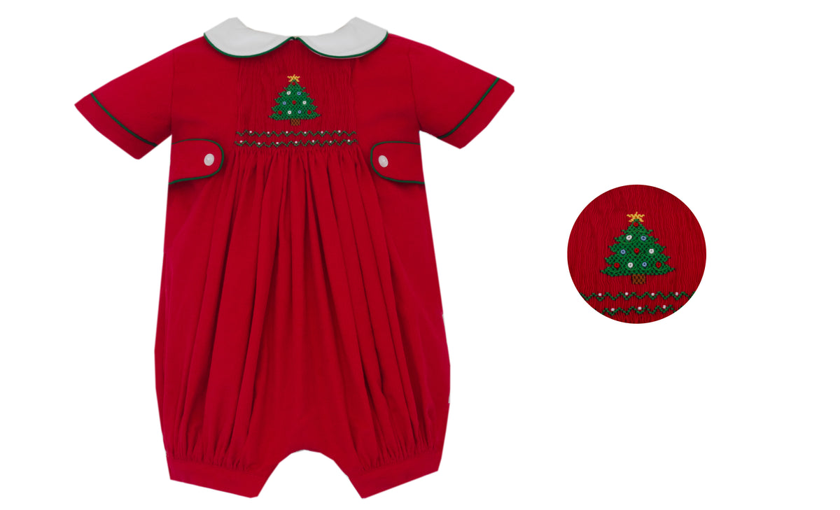 Red baby romper with Christmas tree design on a white background