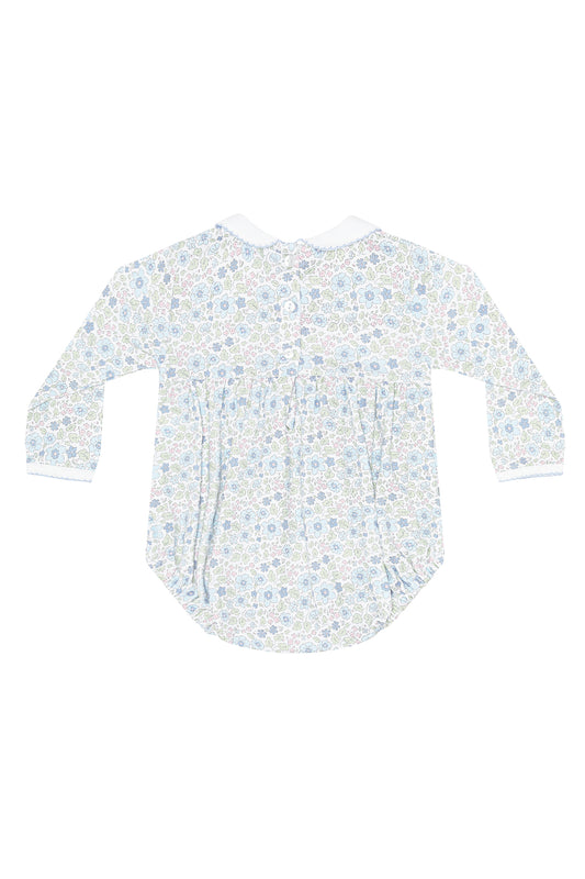 White baby onesie with blue floral pattern on a white background