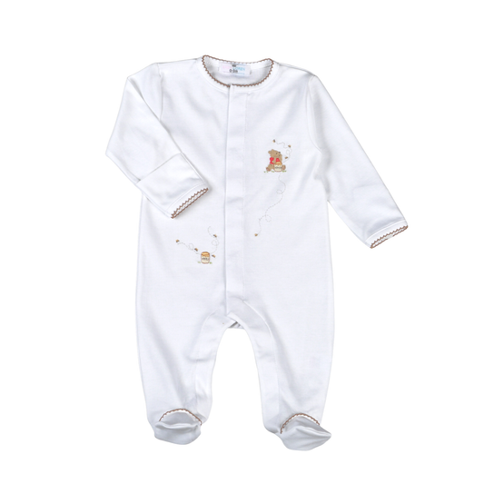 White baby onesie with embroidered details on a white background