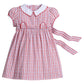Little English classic dress for little girls. Red, white, & light blue plaid dress with scalloped collar, button tabs, and tie waist. Back to school outfit.