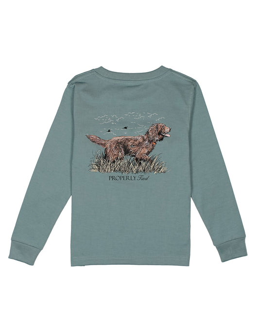 Green long-sleeve shirt with a dog graphic on a white background