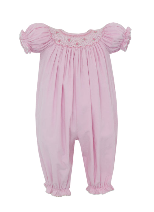 Pink baby romper with ruffled sleeves on a white background