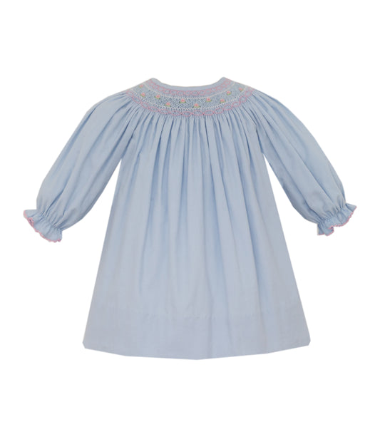 Light blue dress with smocked neckline on a white background