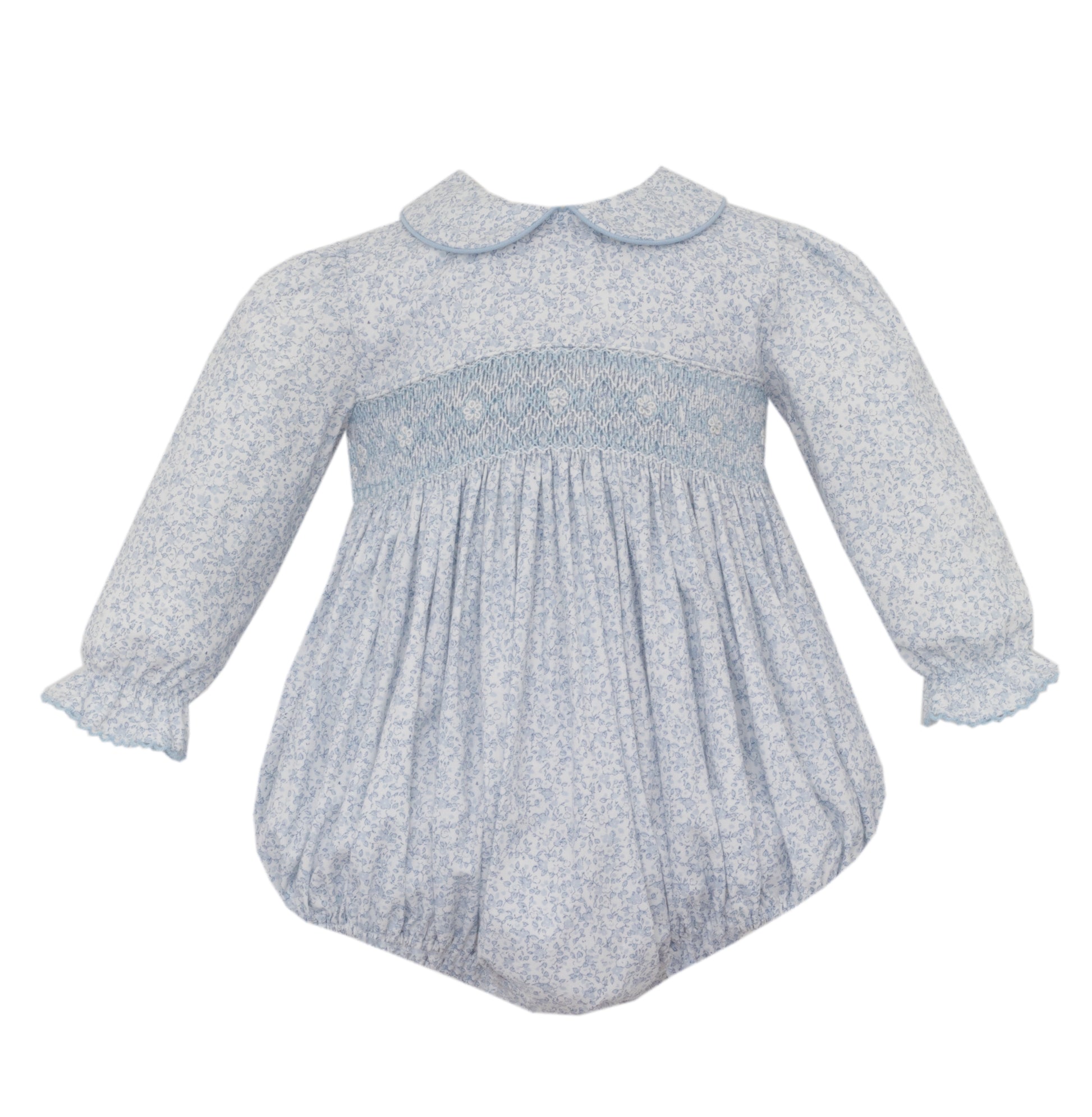 Baby dress with smocked bodice and long sleeves on a white background