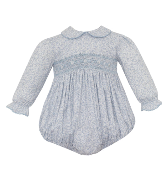 Baby dress with smocked bodice and long sleeves on a white background