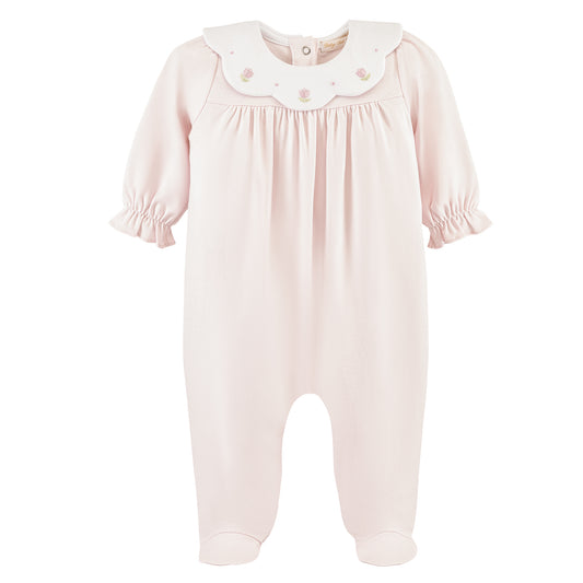 Pink baby romper with a white collar on a white background