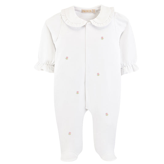 White baby onesie with ruffled collar on a white background
