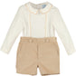 Baby outfit with white long-sleeve top and beige shorts on a white background