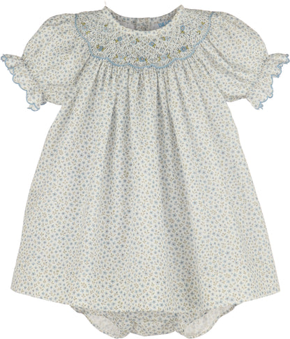 Baby dress with floral pattern on a white background
