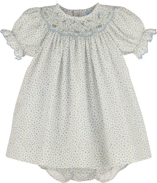 Baby dress with floral pattern on a white background