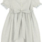 White dress with blue floral pattern on a white background