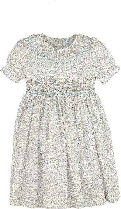 White dress with blue floral pattern on a white background