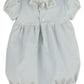 Light blue baby romper with ruffled collar on a white background