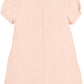 Pink checkered dress with short sleeves on a white background