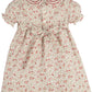 Floral dress with red and pink flowers on a white background