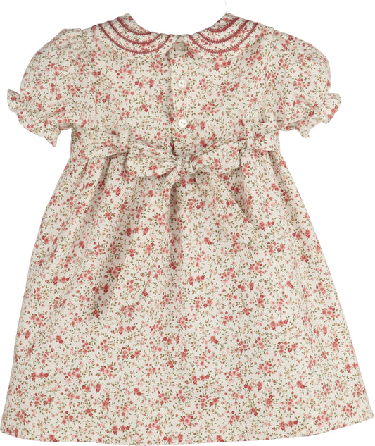 Floral dress with red and pink flowers on a white background