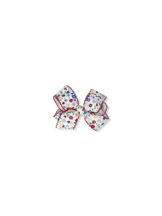 Floral-patterned hair bow on a white background