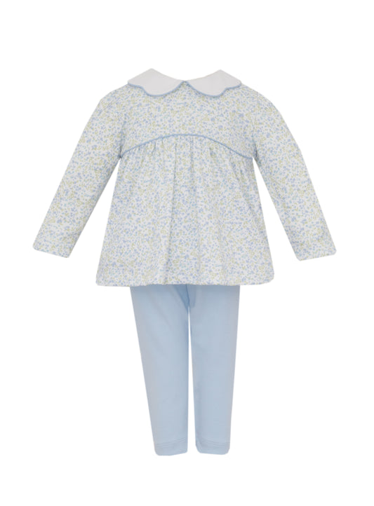 Baby outfit with floral top and light blue pants on a white background