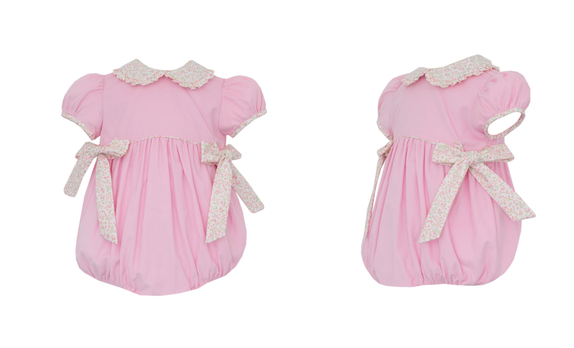 Two pink baby rompers with lace details on a white background
