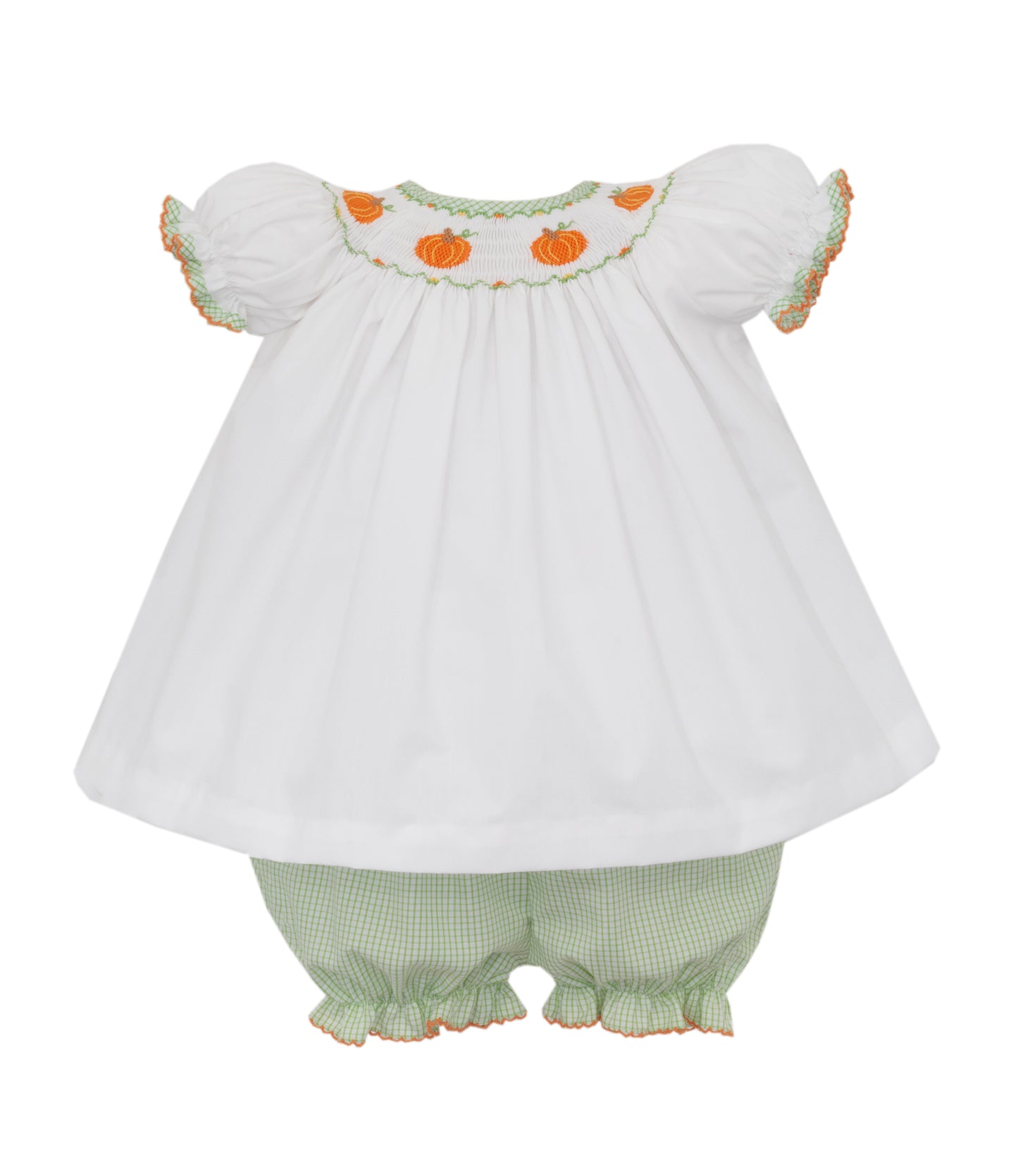 White baby dress with pumpkin embroidery and green checkered bloomers on a white background