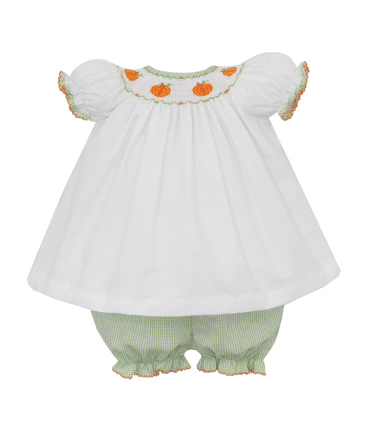 White baby dress with pumpkin embroidery and green checkered bloomers on a white background