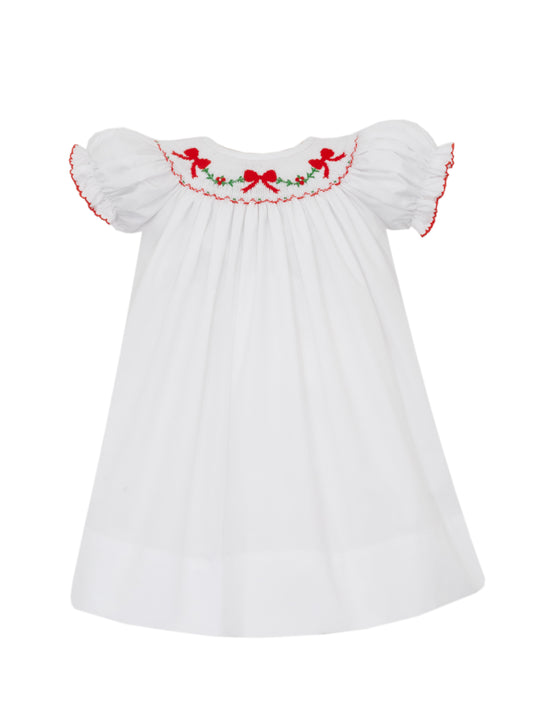 White dress with red embroidery on a white background