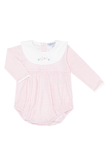 Pink baby outfit with white collar on a white background