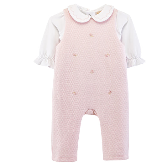 Pink quilted romper with white collar and sleeves on a white background