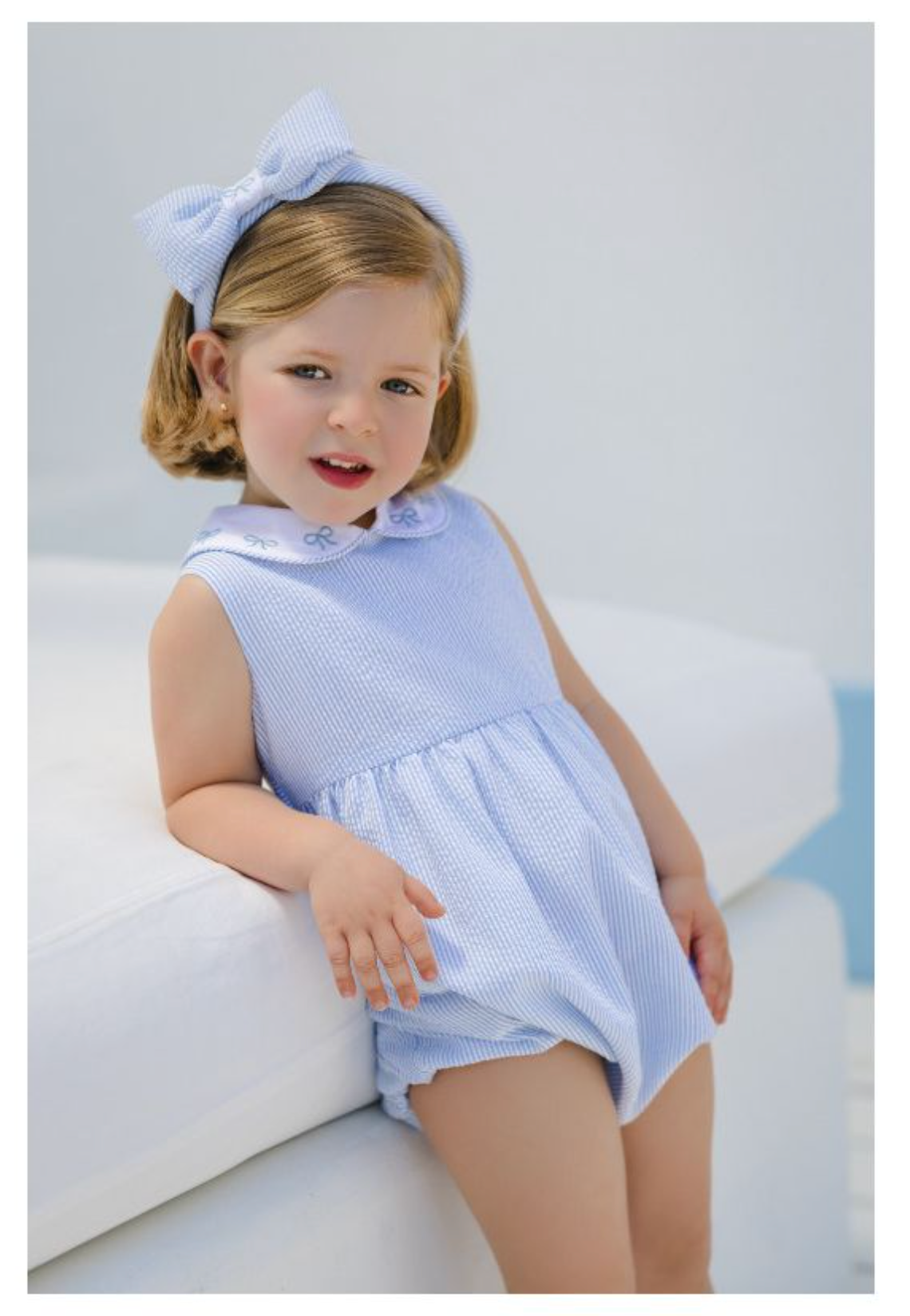 Girl's Blue Seersucker Romper with Bows