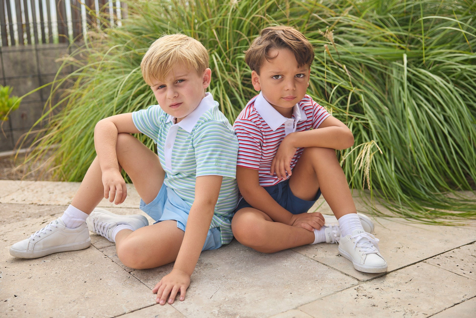 Little English classic short sleeve polo in blue, green, and white greenview stripe and red, white, and blue americana stripe. Sport short in light blue and navy. For little boy 