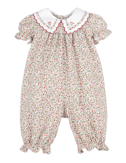 Floral baby romper with a white collar on a white background