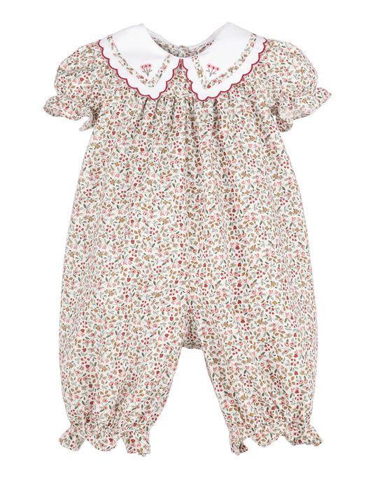 Floral baby romper with a white collar on a white background