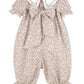 Floral baby romper with ruffled sleeves on a white background